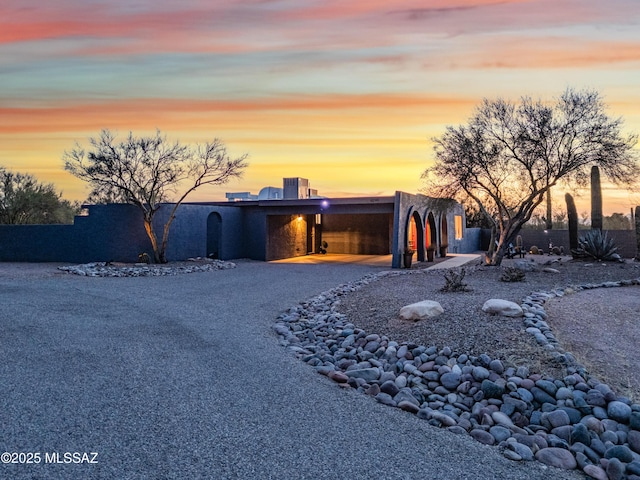 southwest-style home with a carport