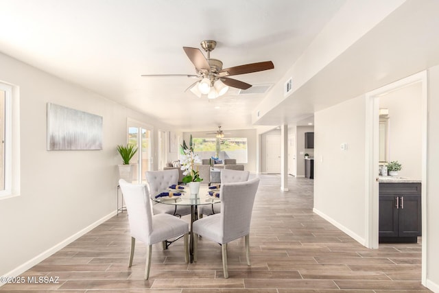 dining room featuring ceiling fan