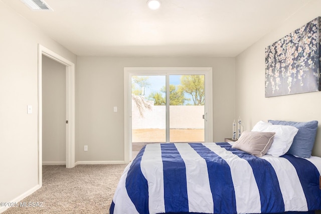 bedroom with carpet flooring and access to exterior