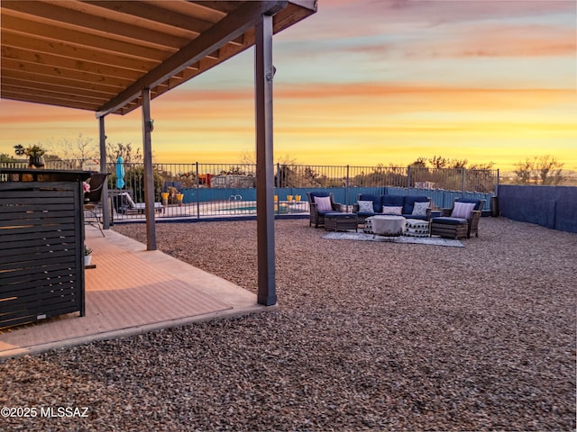 yard at dusk with an outdoor hangout area and a patio area