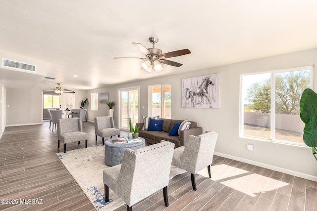 living room featuring ceiling fan