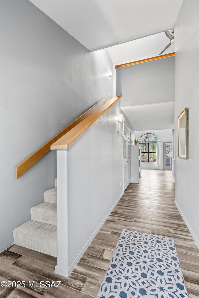 5304 N Paseo De La Terraza, Tucson, AZ 85750 - stairway with wood finished floors, baseboards, ceiling fan, and a towering ceiling