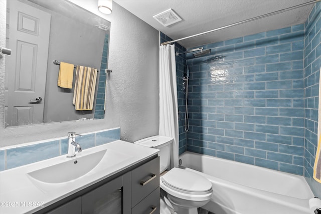 full bathroom featuring shower / tub combo, visible vents, a textured wall, toilet, and vanity