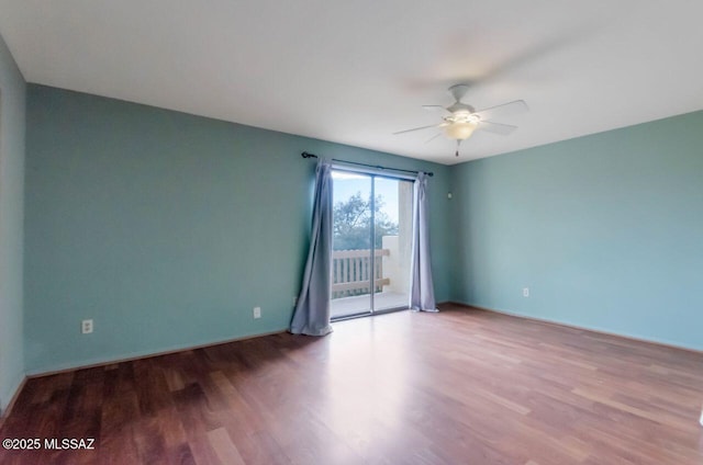 empty room with ceiling fan and light wood-type flooring