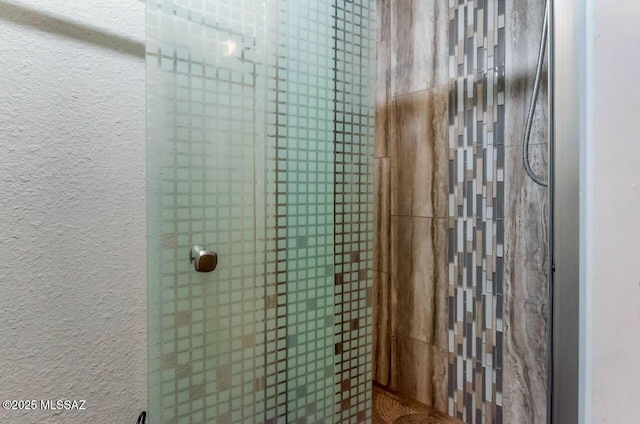 bathroom featuring an enclosed shower