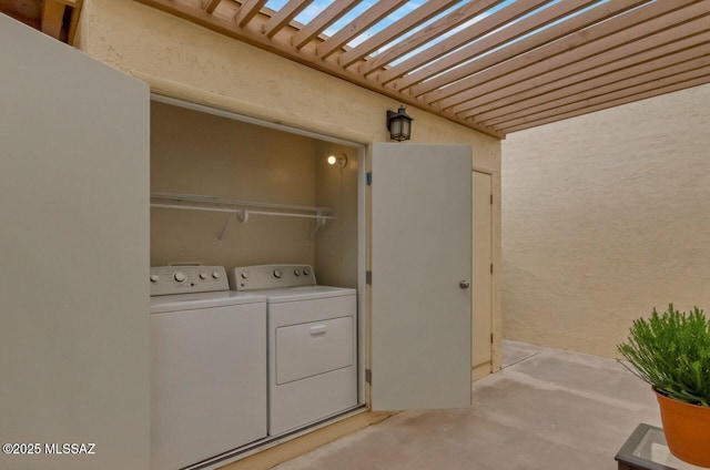 clothes washing area with independent washer and dryer