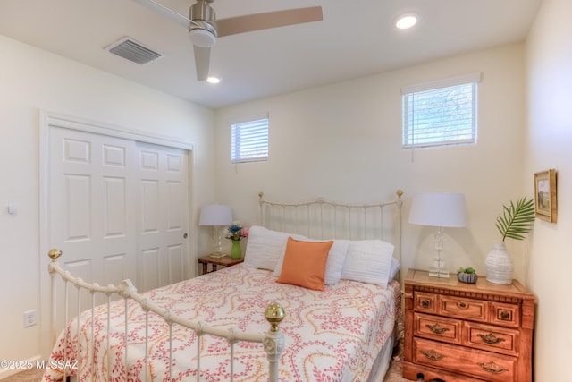 bedroom featuring ceiling fan and a closet