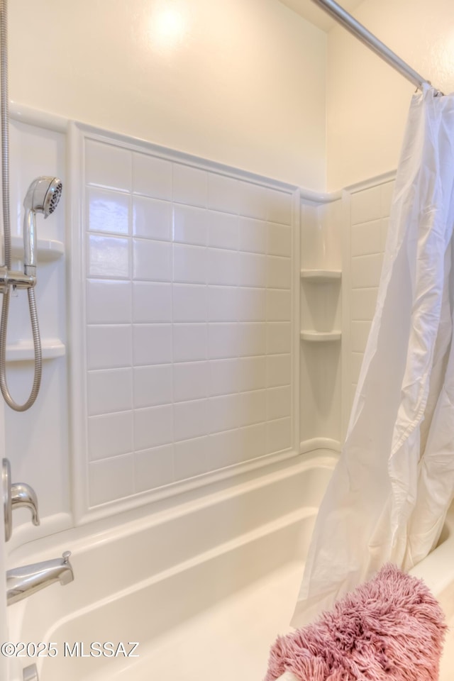 bathroom with shower / bath combination with curtain