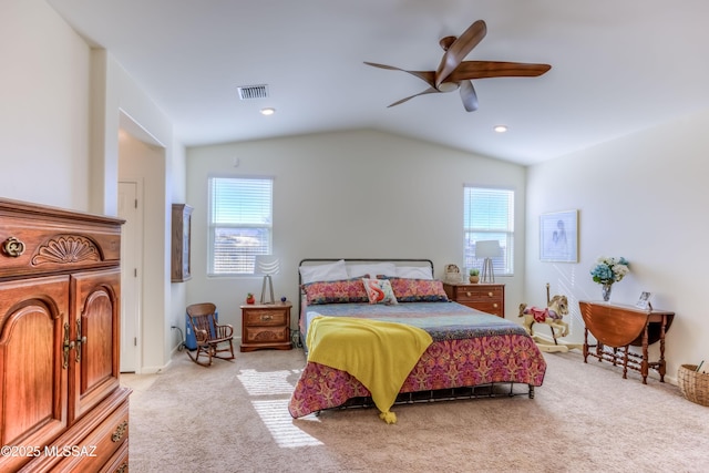 carpeted bedroom featuring ceiling fan and vaulted ceiling