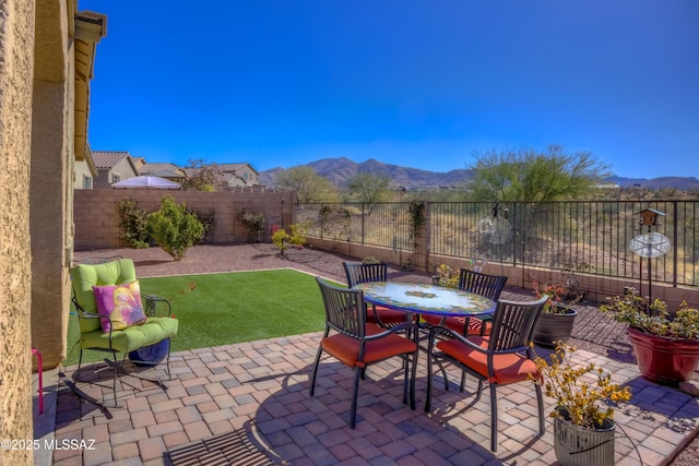 view of patio / terrace featuring a mountain view