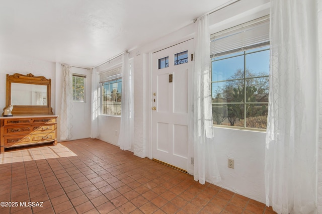 foyer entrance with tile patterned floors