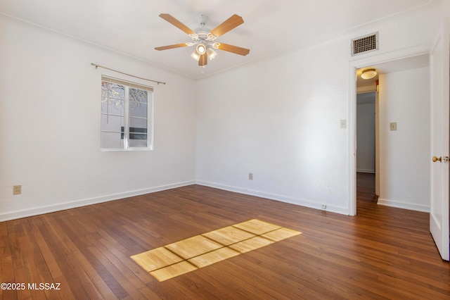 empty room with ceiling fan and dark hardwood / wood-style floors