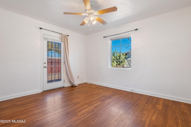 empty room with hardwood / wood-style flooring and ceiling fan