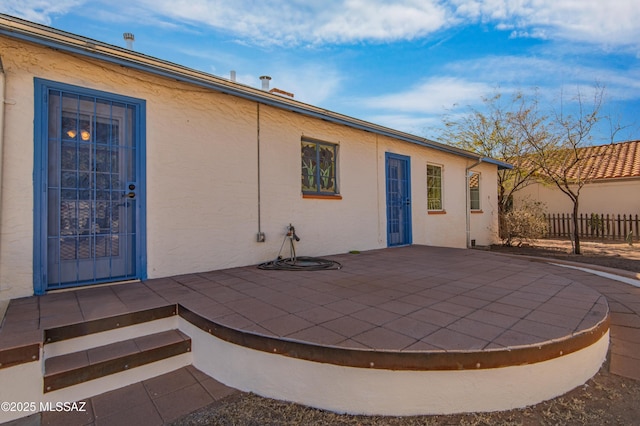 back of property featuring a patio area