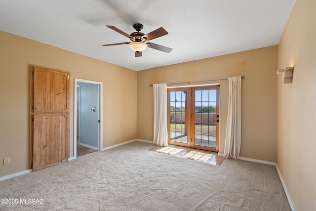 unfurnished room featuring ceiling fan and light carpet