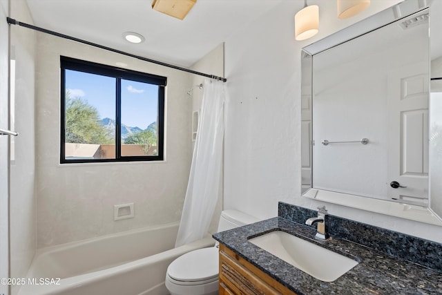 full bathroom featuring toilet, vanity, and shower / bathtub combination with curtain