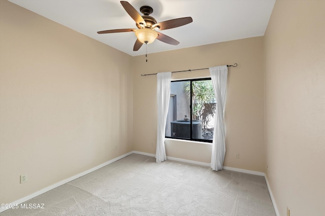 carpeted empty room with ceiling fan