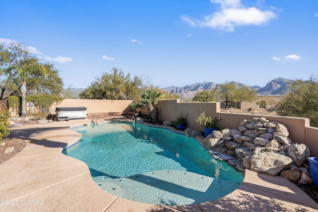 view of pool featuring a mountain view and a jacuzzi