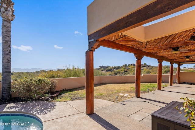 view of patio featuring a pool