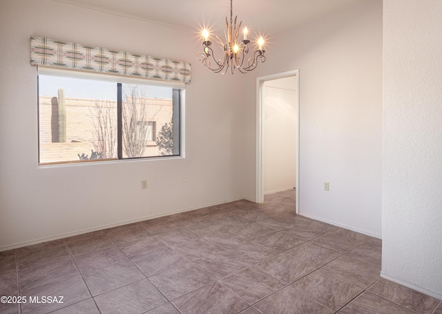 empty room with an inviting chandelier