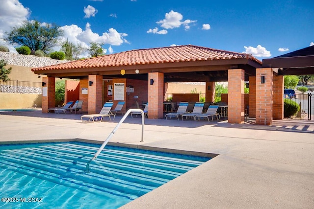 view of swimming pool featuring a gazebo and a patio