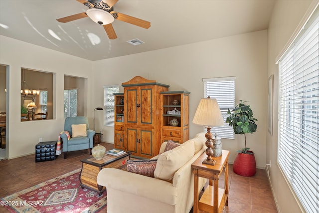 living room featuring tile patterned flooring and ceiling fan