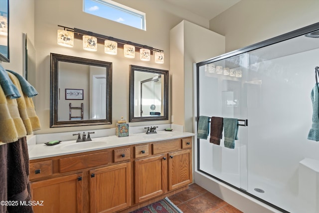 bathroom featuring vanity and a shower with shower door