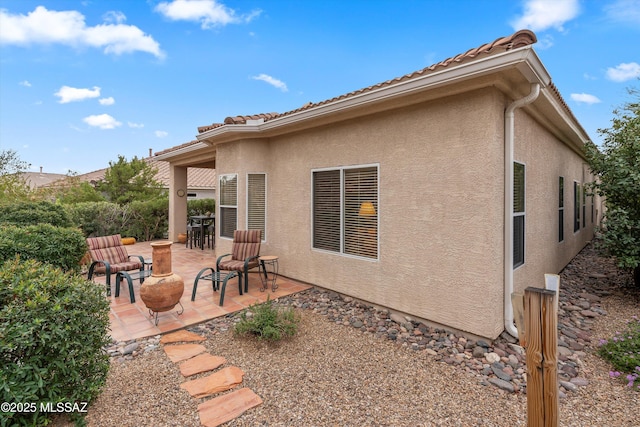 rear view of house with a patio