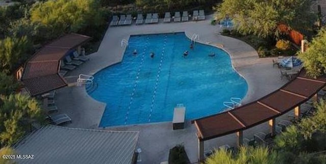 view of swimming pool featuring a patio area