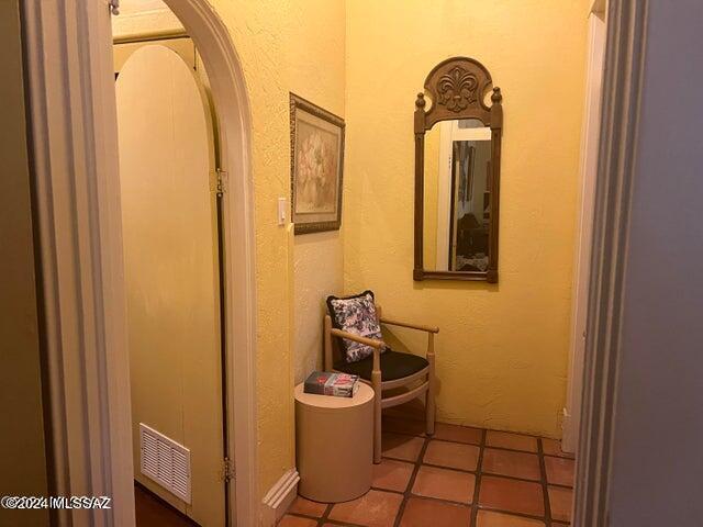 corridor with tile patterned floors