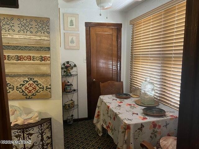 dining space featuring ceiling fan
