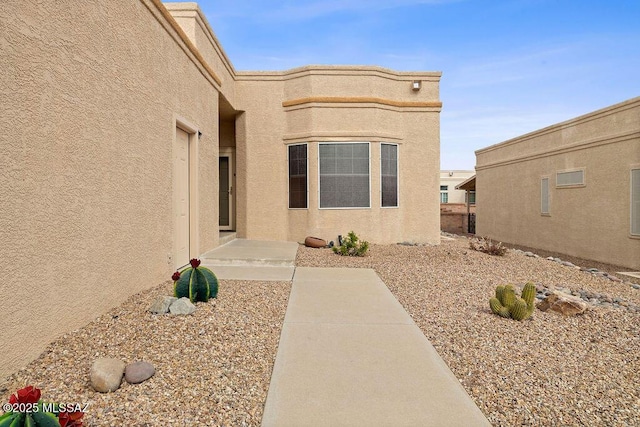 property entrance with a patio area