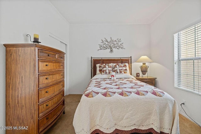 bedroom with carpet and crown molding