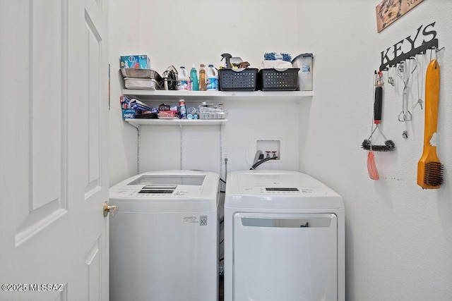 washroom featuring independent washer and dryer