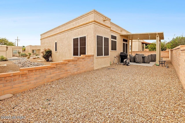 back of house with a patio area