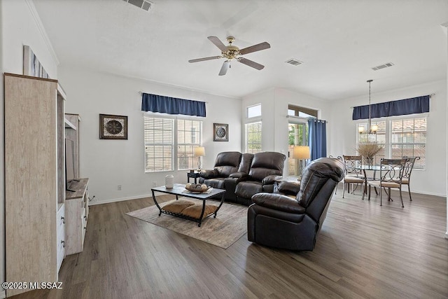 living room with ceiling fan and dark hardwood / wood-style flooring