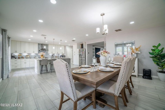 dining area featuring a notable chandelier