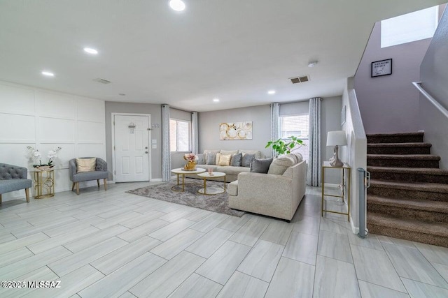 living room featuring plenty of natural light