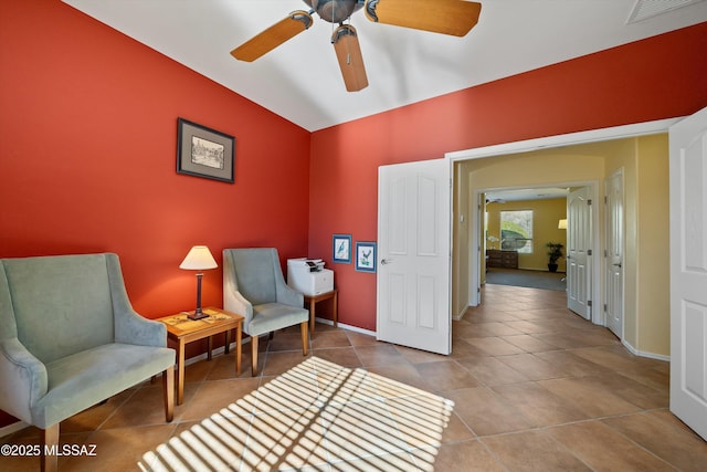 sitting room featuring ceiling fan and light tile patterned floors