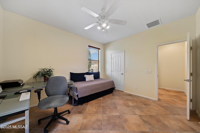 home office featuring light tile patterned floors and ceiling fan