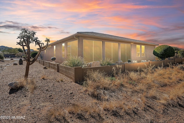 view of property exterior at dusk