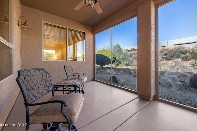 sunroom / solarium with ceiling fan