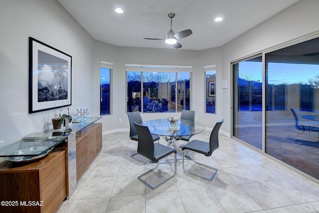 dining area with light tile patterned floors and ceiling fan