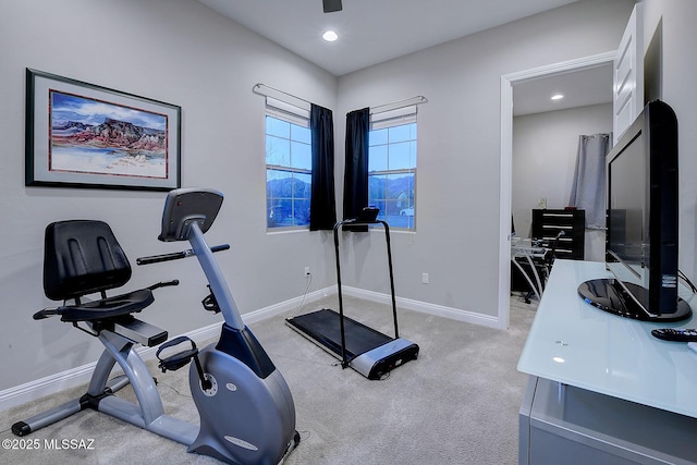 workout room featuring light colored carpet