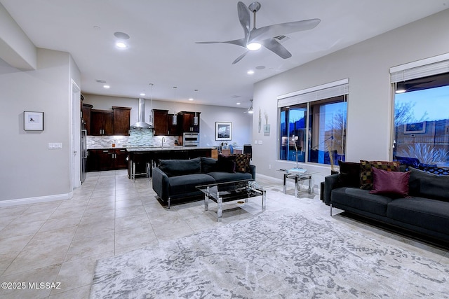 tiled living room featuring ceiling fan