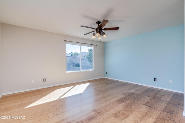 unfurnished room with ceiling fan and hardwood / wood-style floors