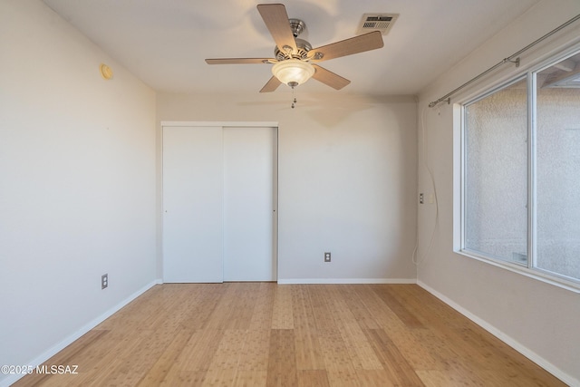 unfurnished bedroom with a closet, ceiling fan, and light hardwood / wood-style flooring