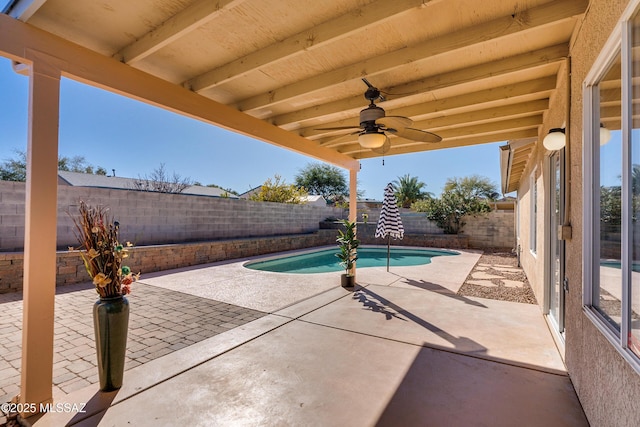 view of patio with ceiling fan and a fenced in pool