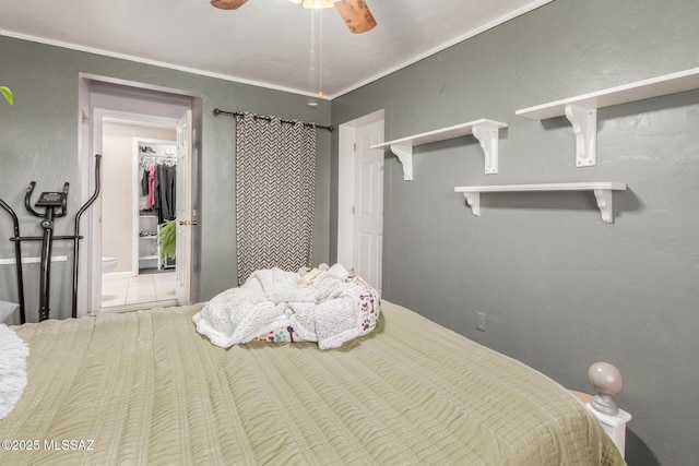 bedroom featuring ceiling fan, crown molding, and tile patterned floors