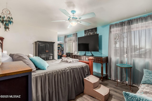 bedroom featuring ceiling fan and wood-type flooring